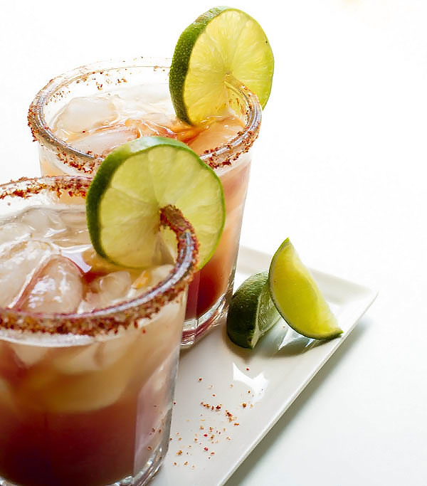 This Life Changing Spicy Michelada is a spicy Mexican take on the classic beer + tomato juice, spiced up with a zesty lime + salt rim for that extra bite!